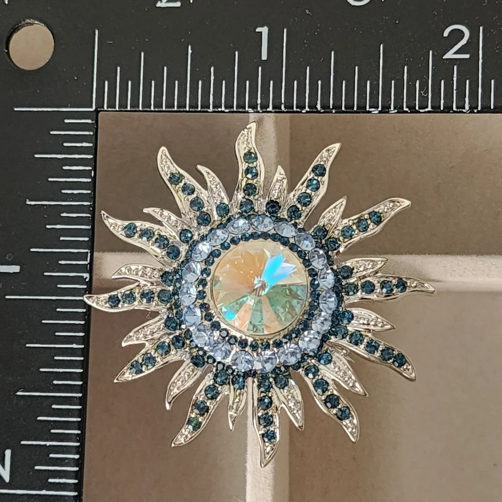 Silver and Blue Starburst Sun Brooch Pin